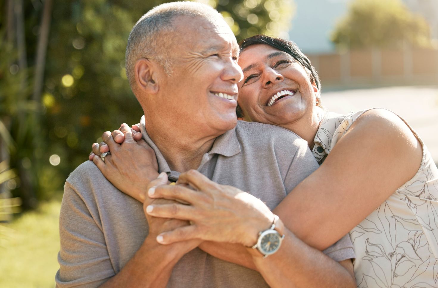 Financing The Cost of Hearing Aids happy couple smiling after financing hearing aids.